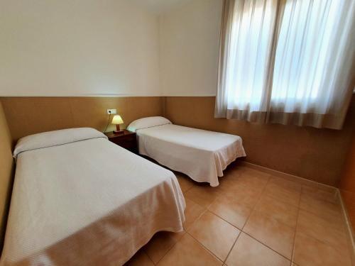 Foto de una habitación de Apartamentos Las Dunas-B