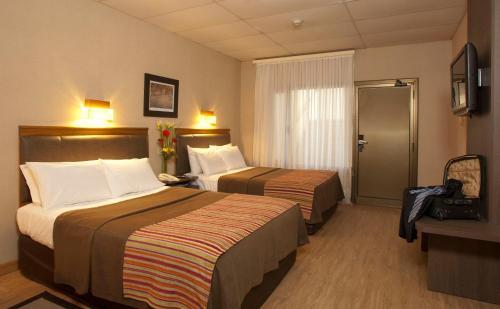 Foto de una habitación de Hotel Land Express Neuquén