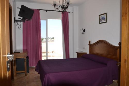 Foto de una habitación de Hotel Oasis Atalaya