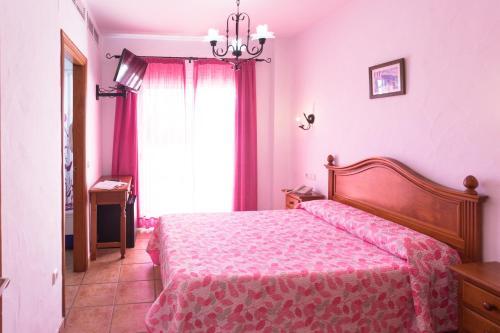 Foto de una habitación de Hotel Oasis Atalaya