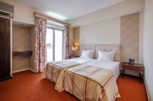 Foto de una habitación de Catolica Hotel