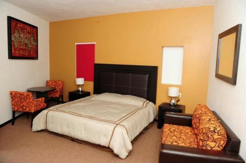 Foto de una habitación de Hotel Montroi Express