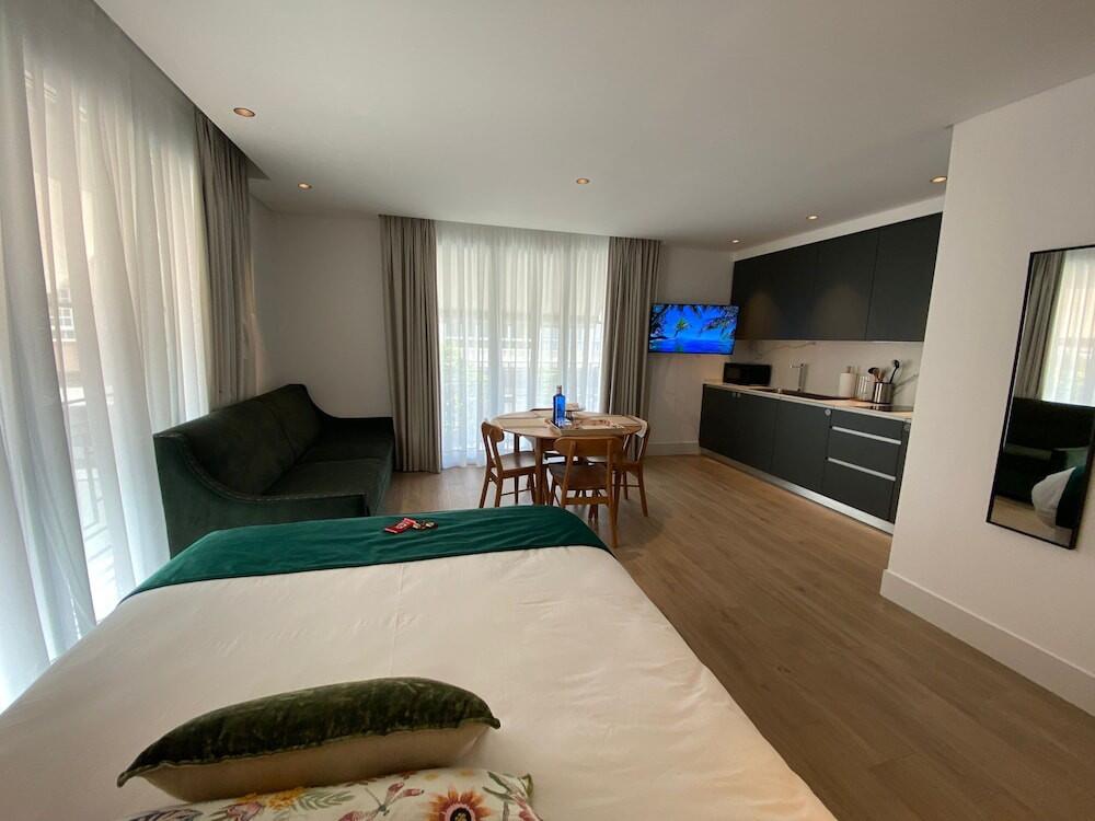 Foto de una habitación de Apartamentos Turísticos La Plaza