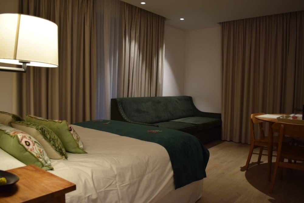 Foto de una habitación de Apartamentos Turísticos La Plaza