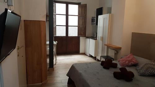 Foto de una habitación de Hostal PLAZA REDONDA brugada home