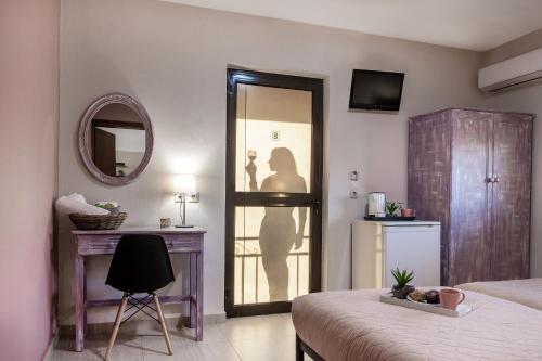 Foto de una habitación de Apartamentos Jo Marinis Rooms