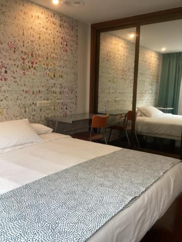 Foto de una habitación de Saudade Hostal Cafetería