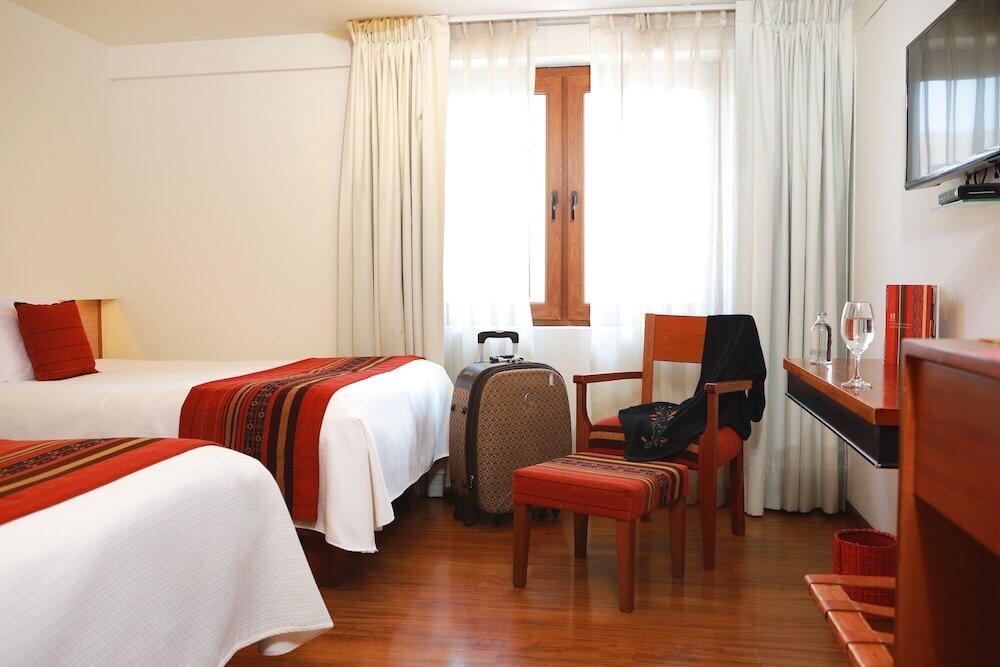 Foto de una habitación de Hotel San Agustin Plaza