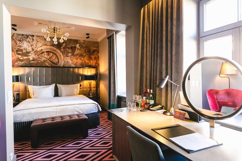 Foto de una habitación de Grand Poet Hotel by Semarah