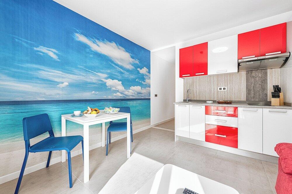 Foto de una habitación de Apartamentos Sol Mogan Suites