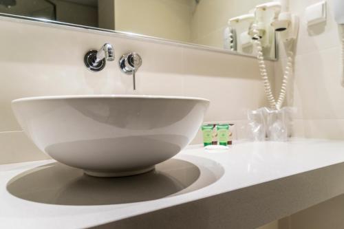 Foto del baño de Castello City Hotel
