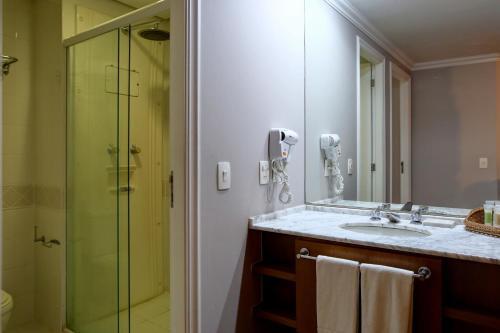 Foto del baño de Apartamentos Roomo Bela Cintra
