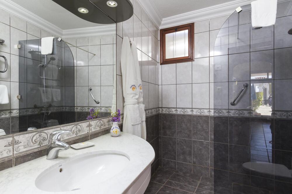 Foto del baño de Apartamentos Sunsuites Carolina