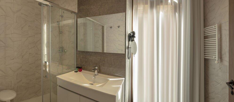 Foto del baño de Hotel SH Suite Palace