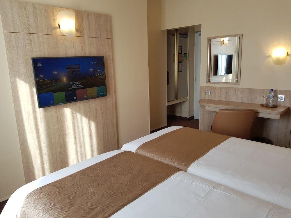 Foto de una habitación de Hotel Champerret Elysees