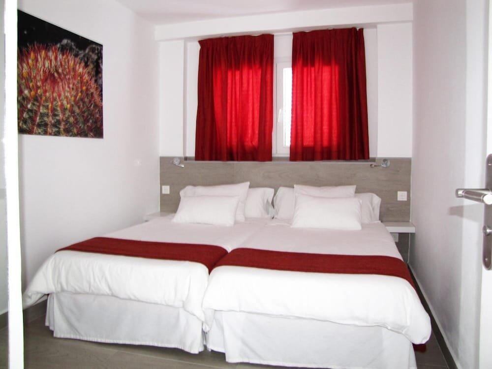 Foto de una habitación de Bungalows Playa Limones