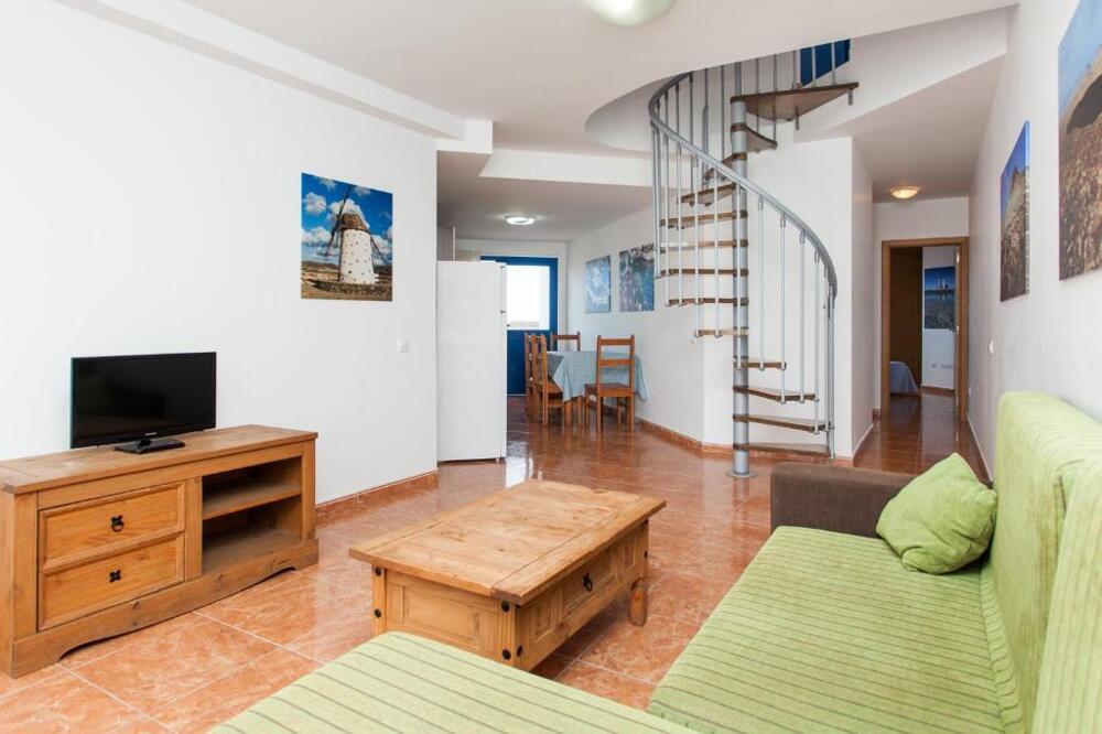 Foto de una habitación de Apartamentos TAO El Cotillo