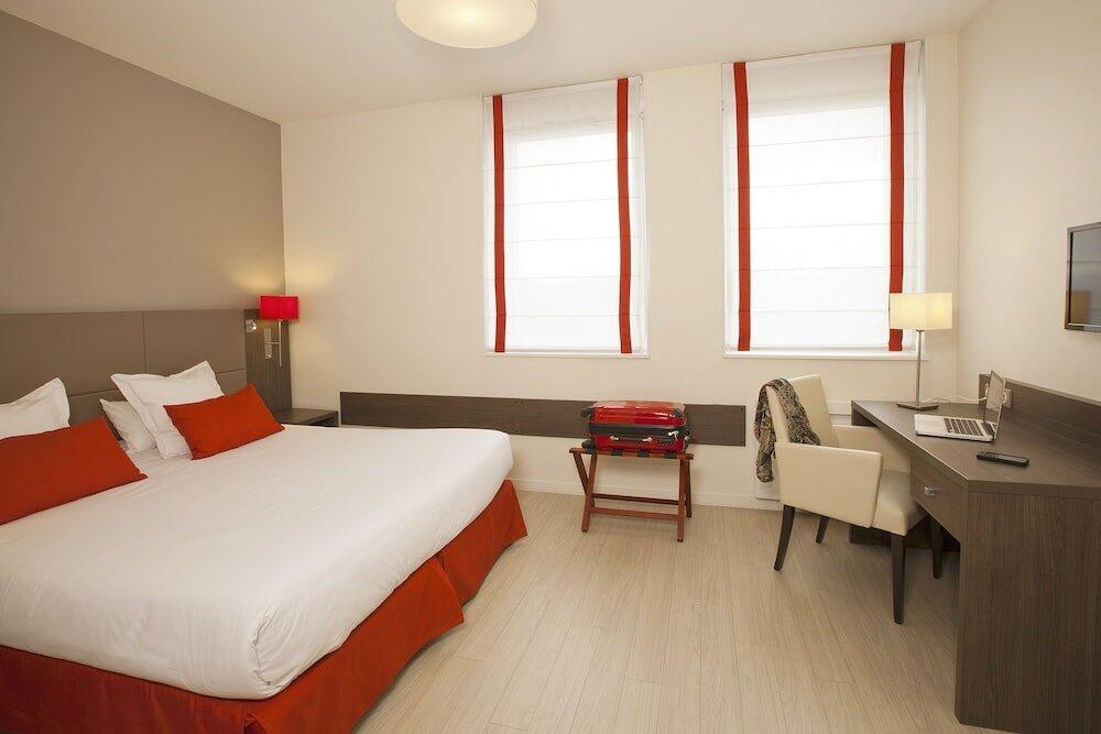 Foto de una habitación de Aparthotel Residhome Reims Centre