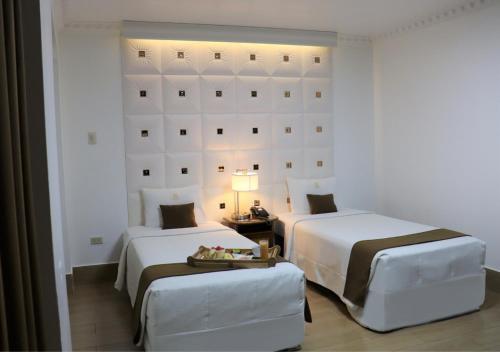Foto de una habitación de Inkari Suites Hotel