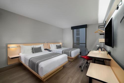 Foto de una habitación de Hotel City Express Plus Insurgentes Sur