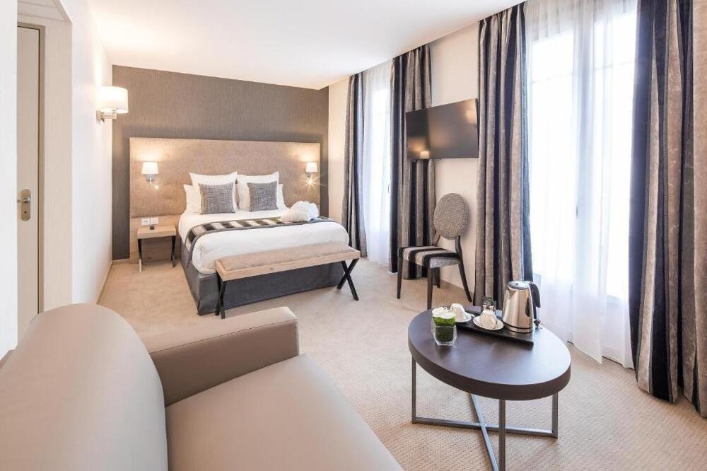 Foto de una habitación de Hôtel Le Rive Droite &amp;amp; SPA
