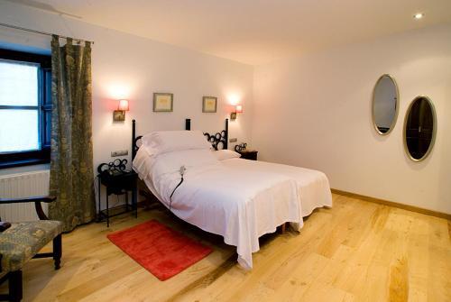 Foto de una habitación de Hotel y apartamentos rurales L&amp;#039;Anceo