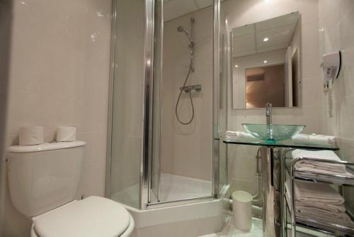Foto del baño de Hôtel Paradis
