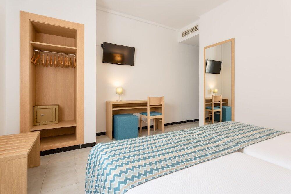 Foto de una habitación de Hotel Riutort