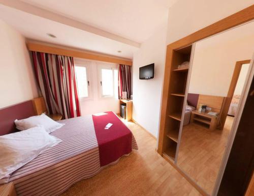 Foto de una habitación de Hotel Amic Colón
