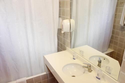 Foto del baño de Hotel Amic Colón