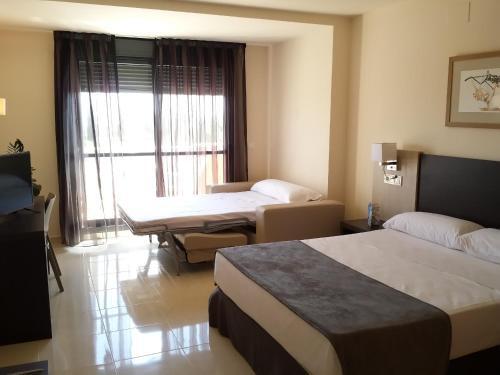 Foto de una habitación de Hotel Adaria Vera