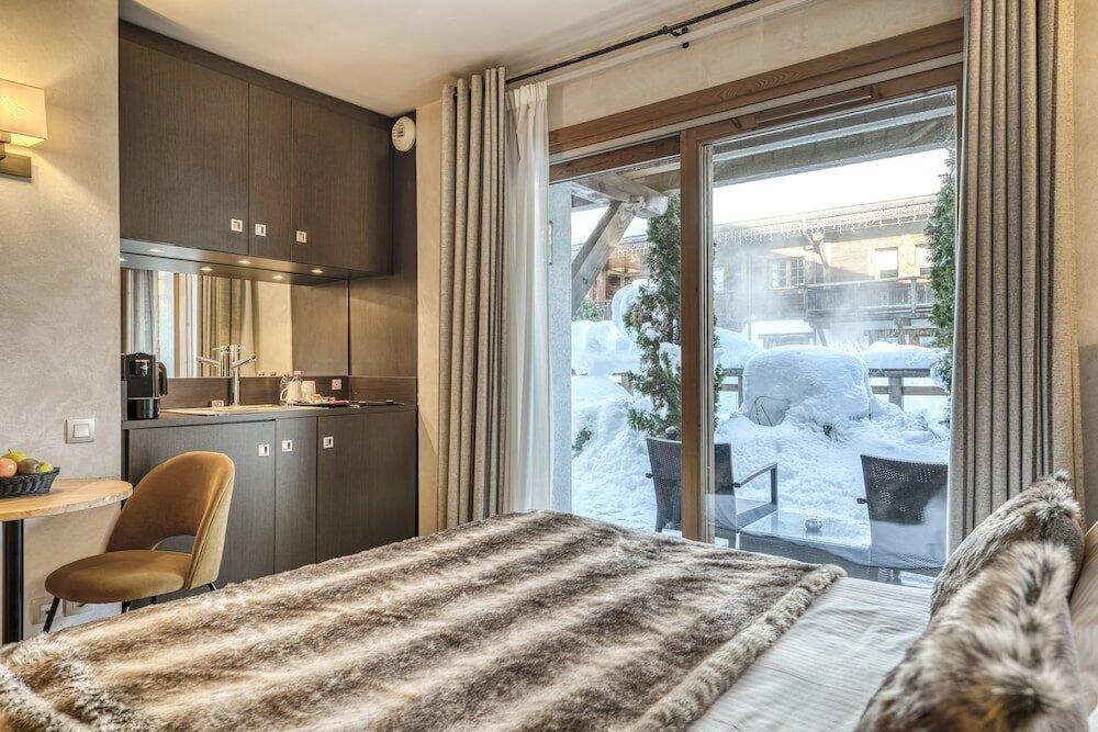 Foto de una habitación de Hotel Les Loges Blanches