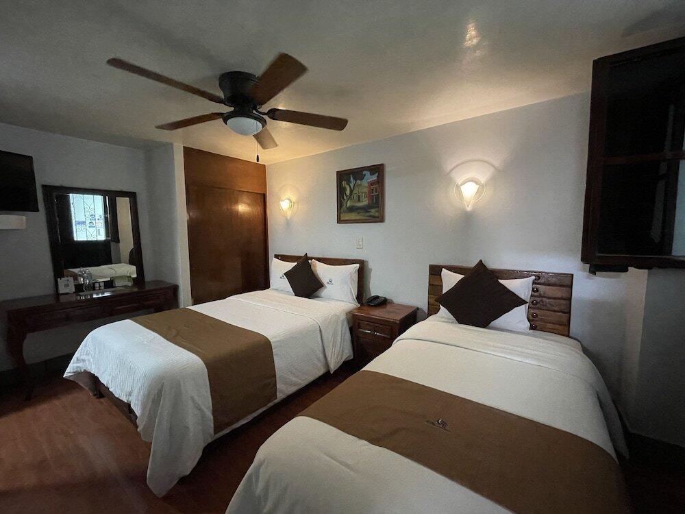 Foto de una habitación de Hotel Puebla Plaza