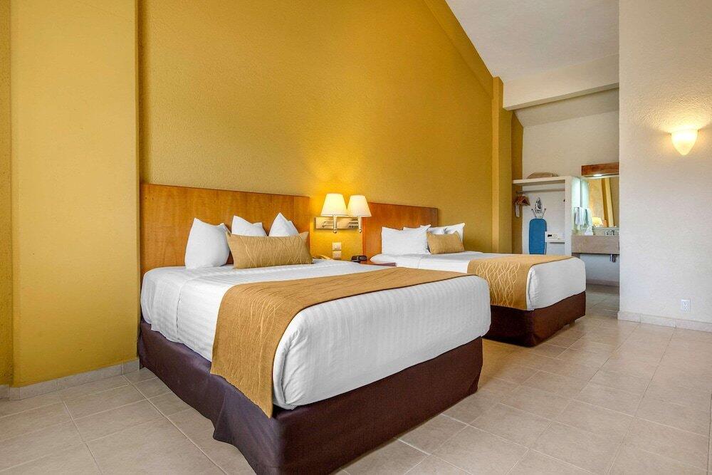 Foto de una habitación de Hotel Comfort Inn Puerto Vallarta
