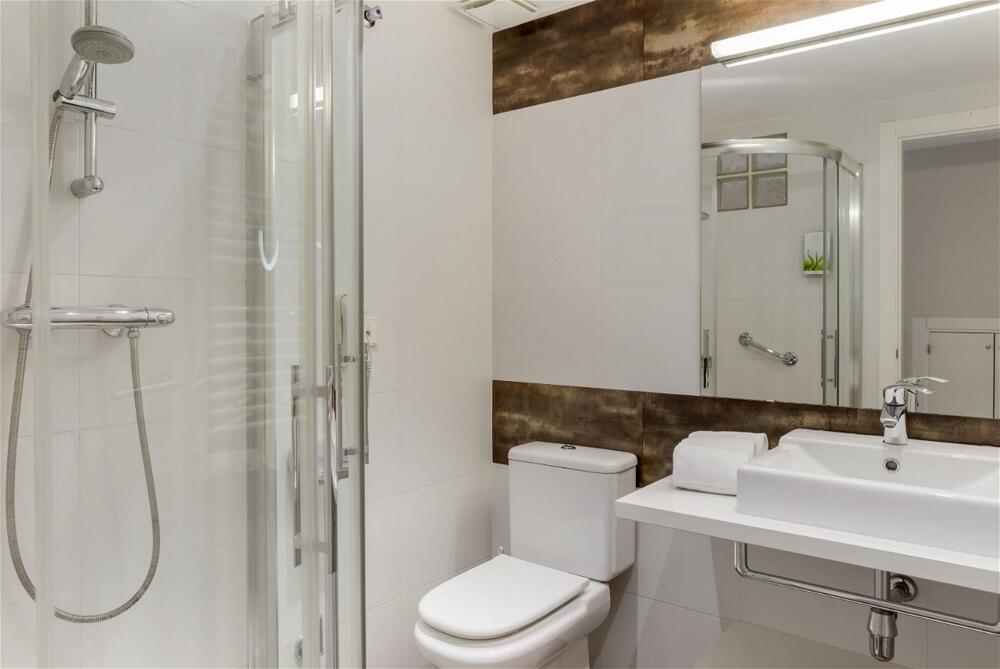 Foto del baño de Aparthotel Los Amigos Beach Club