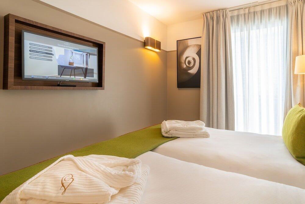 Foto de una habitación de Aparthotel Fraser Suites Harmonie Paris La Défense