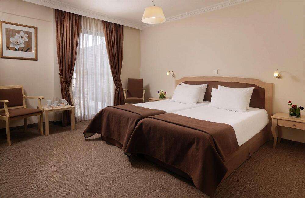 Foto de una habitación de Hotel Airotel Parthenon