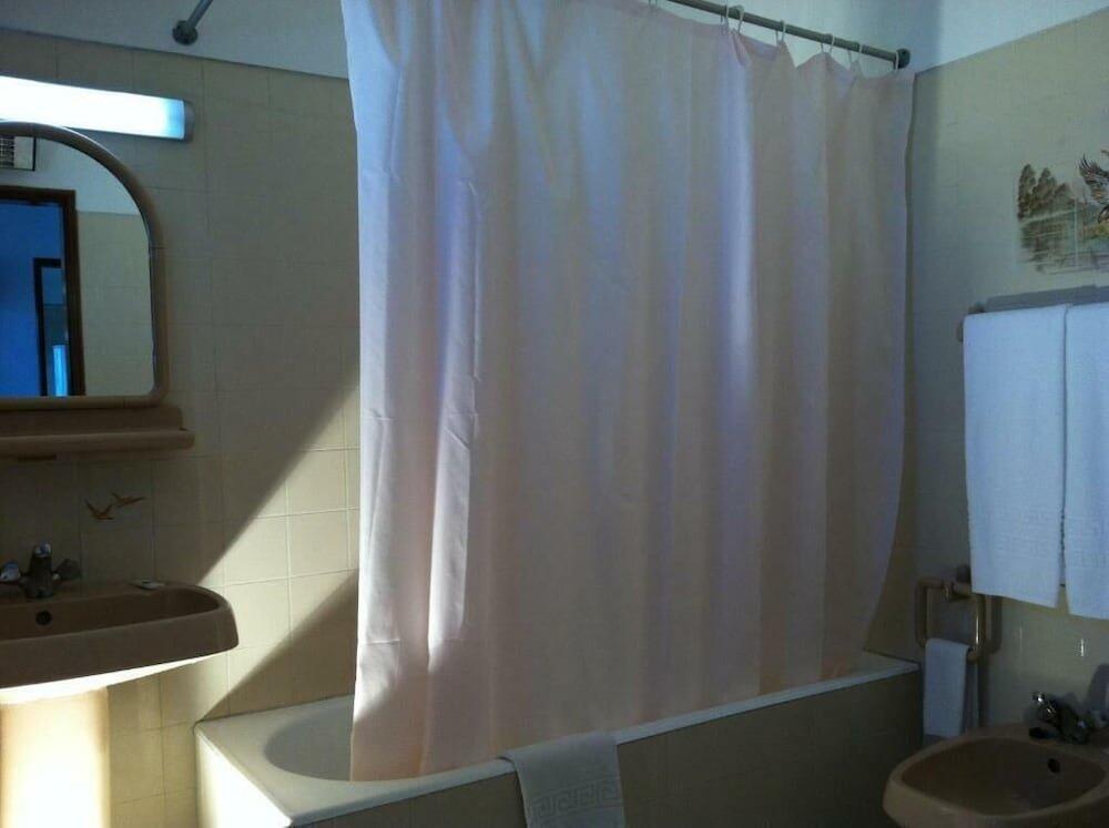 Foto del baño de Aparthotel Turiquintas