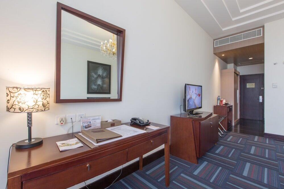 Foto de una habitación de Merlynn Park Hotel