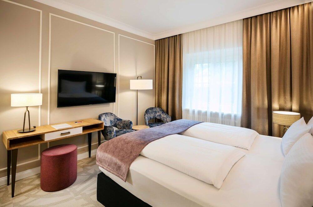 Foto de una habitación de Hotel ARCOTEL Castellani Salzburg