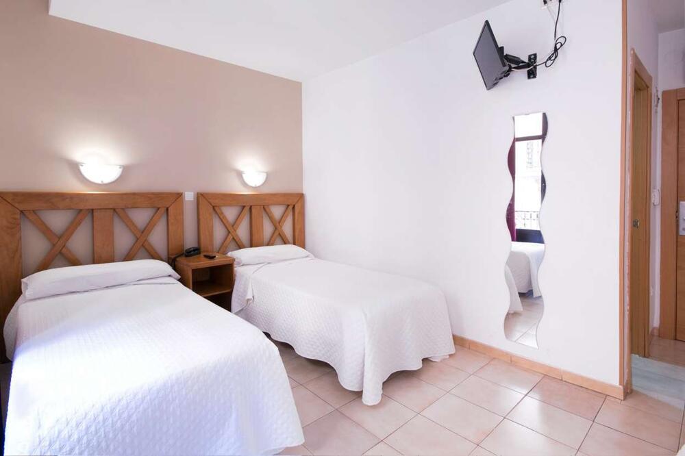 Foto de una habitación de Hostal Atenas Granada