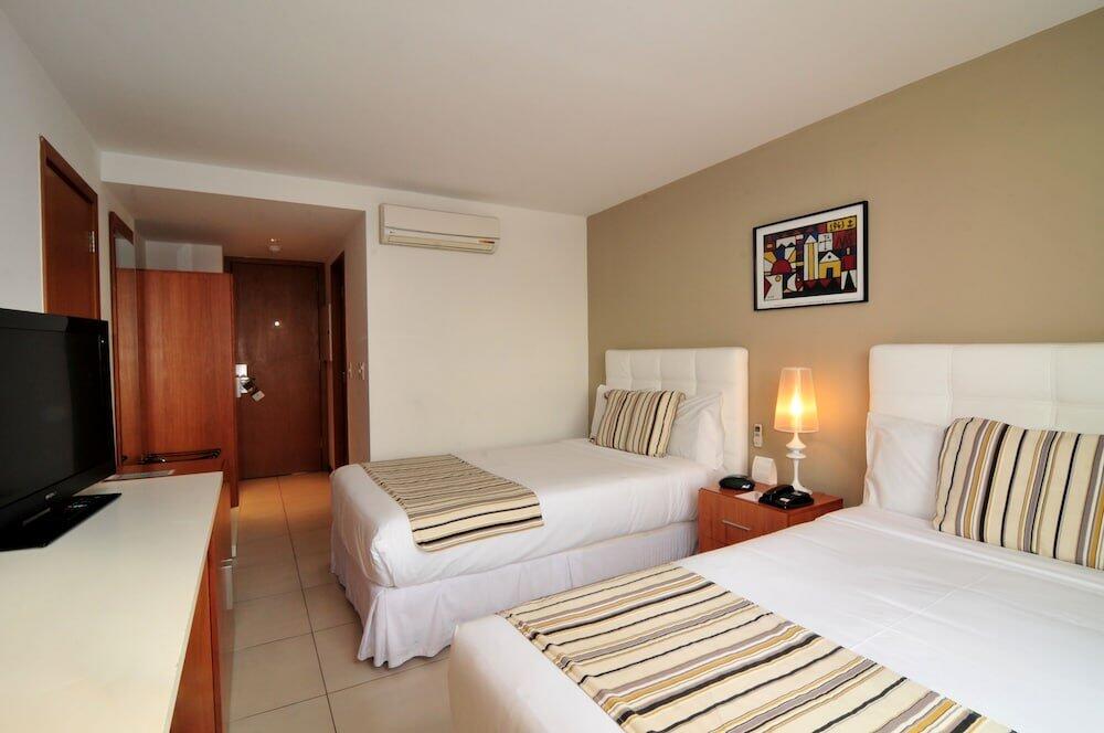 Foto de una habitación de Real Colonia Hotel &amp;amp; Suites