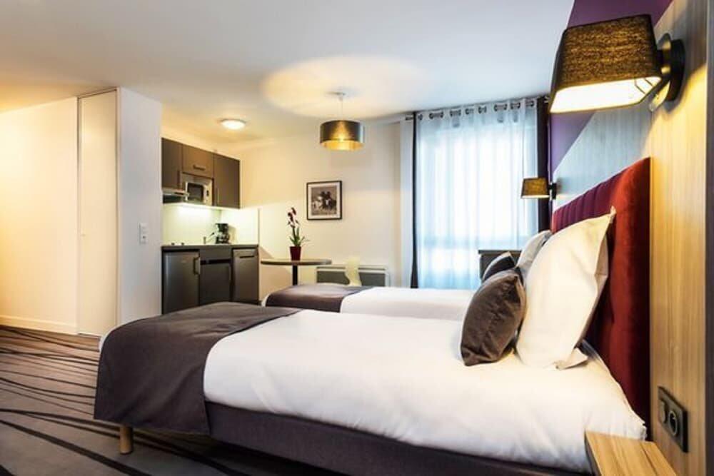 Foto de una habitación de Nemea Appart Hotel Quai Victor Tours Centre