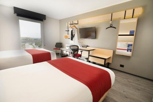 Foto de una habitación de Hotel City Express Santiago Aeropuerto