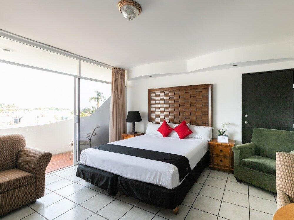 Foto de una habitación de Hotel Capital O Zona Dorada Inn, Mazatlán
