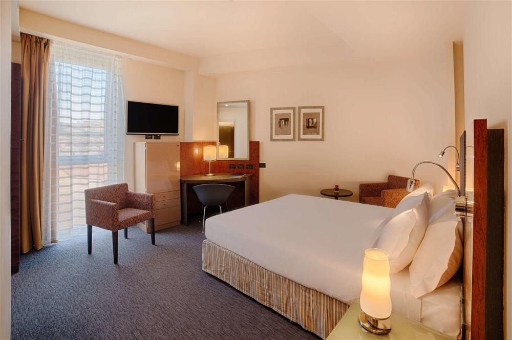 Foto de una habitación de Hotel NH Bergamo