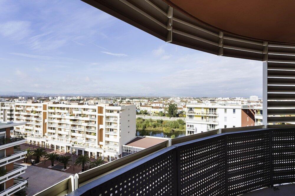 Foto de una habitación de Aparthotel Mer &amp;amp; Golf City Perpignan Centre
