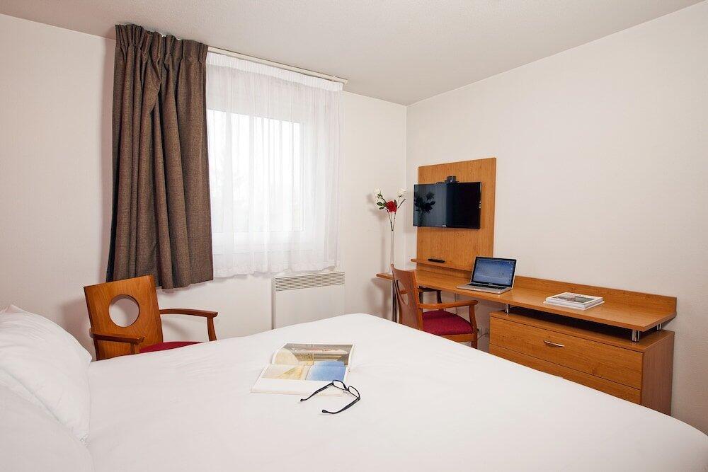 Foto de una habitación de Aparthotel Séjours &amp;amp; Affaires Bordeaux de L&amp;#039;Yser