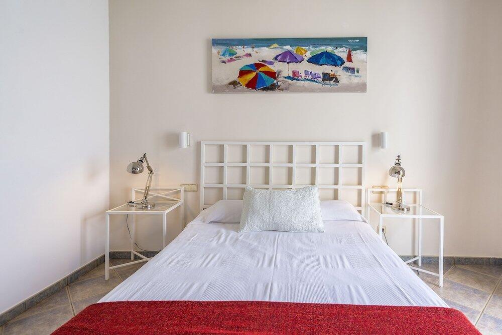 Foto de una habitación de Villas Puerto Rubicon