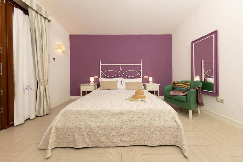 Foto de una habitación de Hotel Residence Il Porto